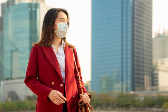Asian girl use a protection mask for prevent PM 2.5 and corona viruus or covic 19