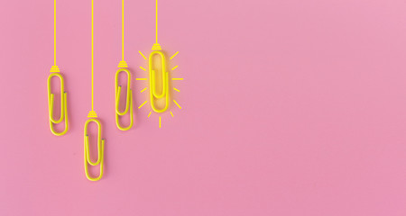 Great ideas concept with paperclip,thinking,creativity,light bulb on blue background,new ideas concept.