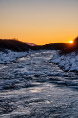 winter sunset over the river in Iceland