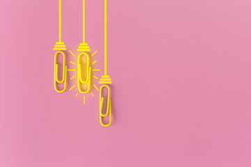 Great ideas concept with paperclip,thinking,creativity,light bulb on blue background,new ideas concept.