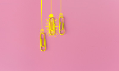 Great ideas concept with paperclip,thinking,creativity,light bulb on blue background,new ideas concept.