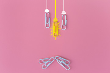 Great ideas concept with paperclip,thinking,creativity,light bulb on blue background,new ideas concept.