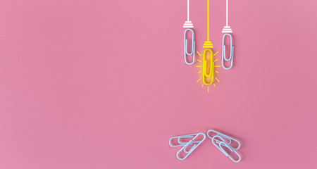 Great ideas concept with paperclip,thinking,creativity,light bulb on blue background,new ideas concept.