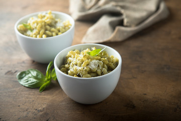 Pasta with pesto sauce and cheese