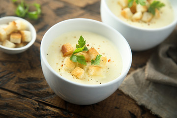 Homemade cheese soup with bread croutons