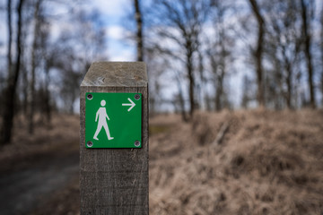 Information about hiking routes. Sign post with directions for hiking paths in National Park de Groote Peel, Limburg. 