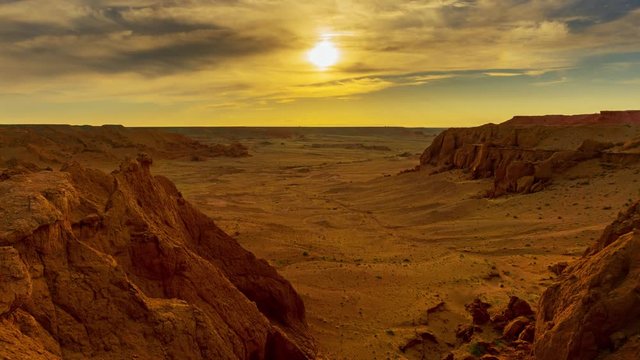 Bayanzag flaming cliffs at sunset in Mongolia, found in the Gobi Desert, timelapse 4k