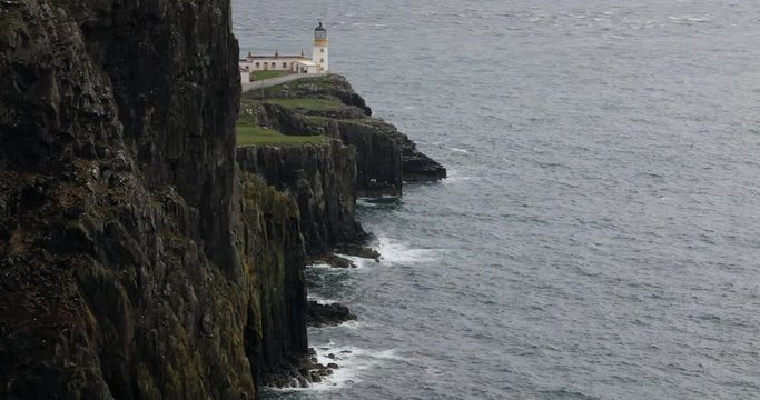 Ancient Scottish lighthouse on cape. 4K Footage.