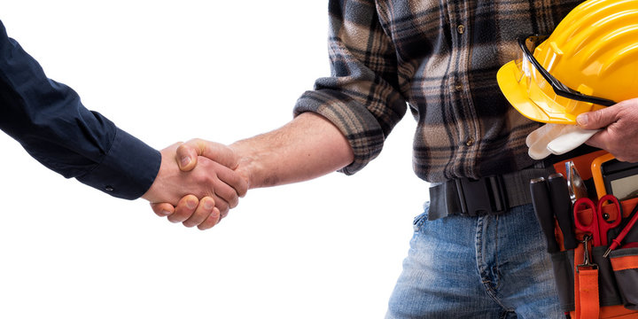 Close-up of a handshake of the electrician carpenter holding helmet and protective goggles in hand. Construction industry, electrical system. Isolated on a white background.