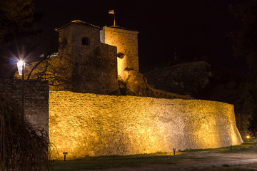 Beautiful golden lights on the walls and towers of ancient Momcilov grad fortress in Pirot