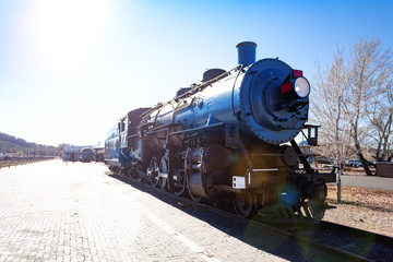 Front view of old steam iron big locomotive on the station in Arizona, USA