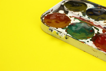 Set of watercolor paints closeup. Selective focus. Space for text