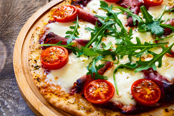 Margherita pizza on wooden table