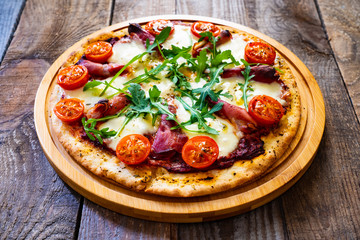 Margherita pizza on wooden table