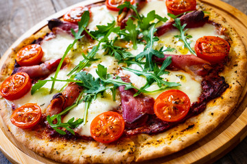 Margherita pizza on wooden table
