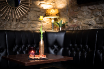 Table and seats  setup for romantic couple in a city Wine Bar