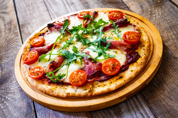 Margherita pizza on wooden table