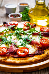 Margherita pizza on wooden table