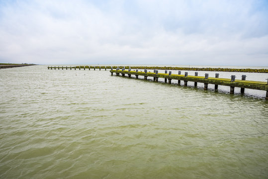 Pier in Markermeer by the road N701 between Almere and Lelystad in Netherlands