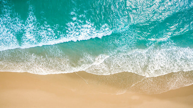 Top view aerial image from drone of an stunning beautiful sea landscape beach with turquoise water with copy space for your text.Beautiful Sand beach with turquoise water,aerial UAV drone shot © kanpisut
