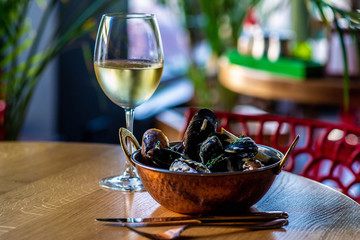 Chinese cuisine, oysters with white wine in restaurant