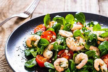 Prawn salad on wooden table