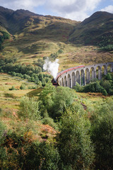 The Hogwarts Express train on the Glenfinnan Viaduct in the Scottish Highlands