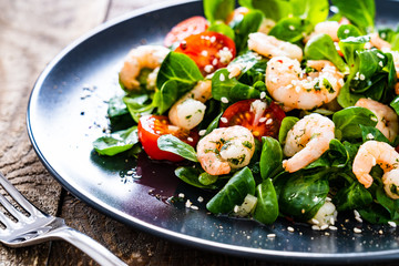 Prawn salad on wooden table