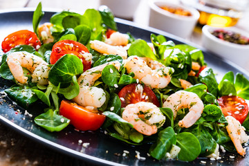 Prawn salad on wooden table