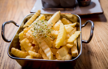 Fried chicken nuggets with french fries and tomato sauce. Restaurant.
