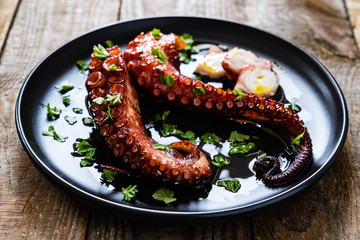 Barbecue octopus on wooden table © Jacek Chabraszewski