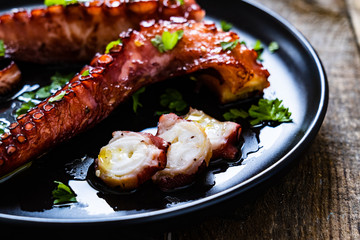 Barbecue octopus on wooden table
