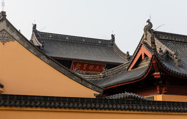 Fototapeta na wymiar Architecture in Sanguan Tang or Temple with main hall behind, a Buddhist nun temple or monastery on Wan'an Road in Jiangwanzhen, Hongkou, Shanghai, China. Built in Qing Dynasty.