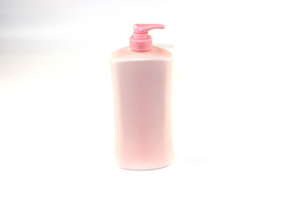 Empty pink pump bottle isolated on white background.