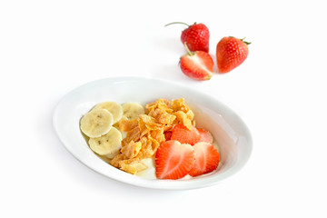 Healthy breakfast with strawberries and bananas with cornflakes