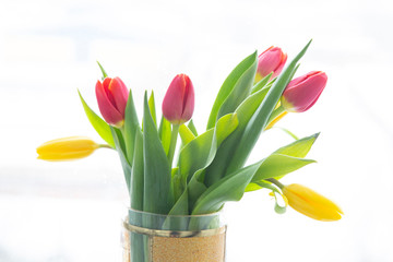 Bouquet of tulips on a white background. Flower shop.