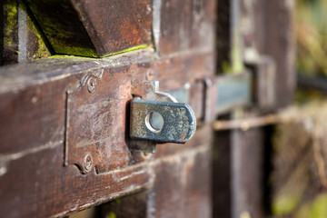 Detail of fittings of old brown garden wooden doors