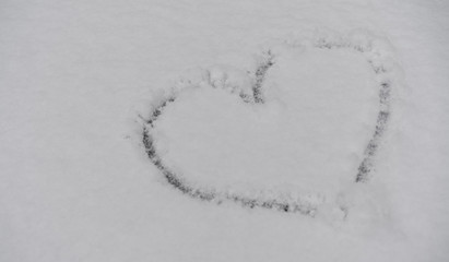Image of a heart in white snow