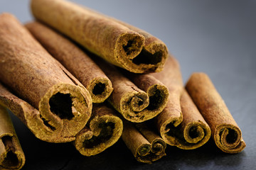 dry Cinnamon stick isolated on black ground