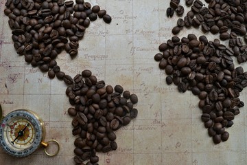 coffee beans on the map with compass