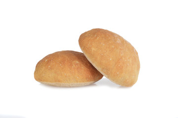 closeup of two ciabatta bread rolls on white