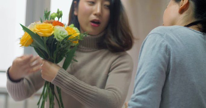 4k,chinese young girl florist is training her pregnant friend flower arrangement skills, she showing her collocation and adjustment of bouquet,in chengdu china