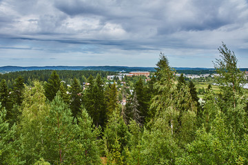Panorama of Karelian nature from a height.Panoramic view of the surroundings of Sortavala from a hill in a city park: a forest of conifers, traces of volcanic lava, rocks and volcanic rocks. Russia
