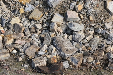 Construction waste with elements of and destroyed old structures at municipal landfill