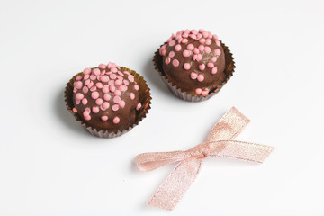Chocolate Potato Cake. Decorated with sprinkles. On white background.
