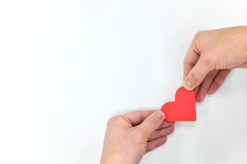 Red heart shape on hands like wings. Spread love concept.
