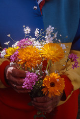 woman holding a bouquet of flowers