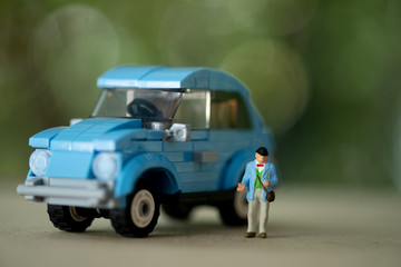 Miniature grandfather stand with vintage car