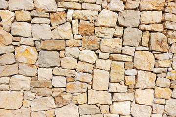 Obraz premium Mur z kamieni z nieregularnym wzorem tekstury tła