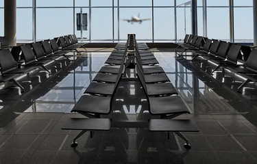 Rows of black chairs at airport and plane landing